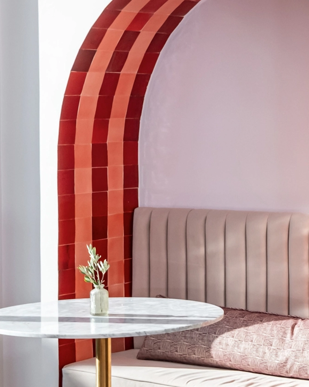 Terrace with tiled arch featuring red and pink zellige 